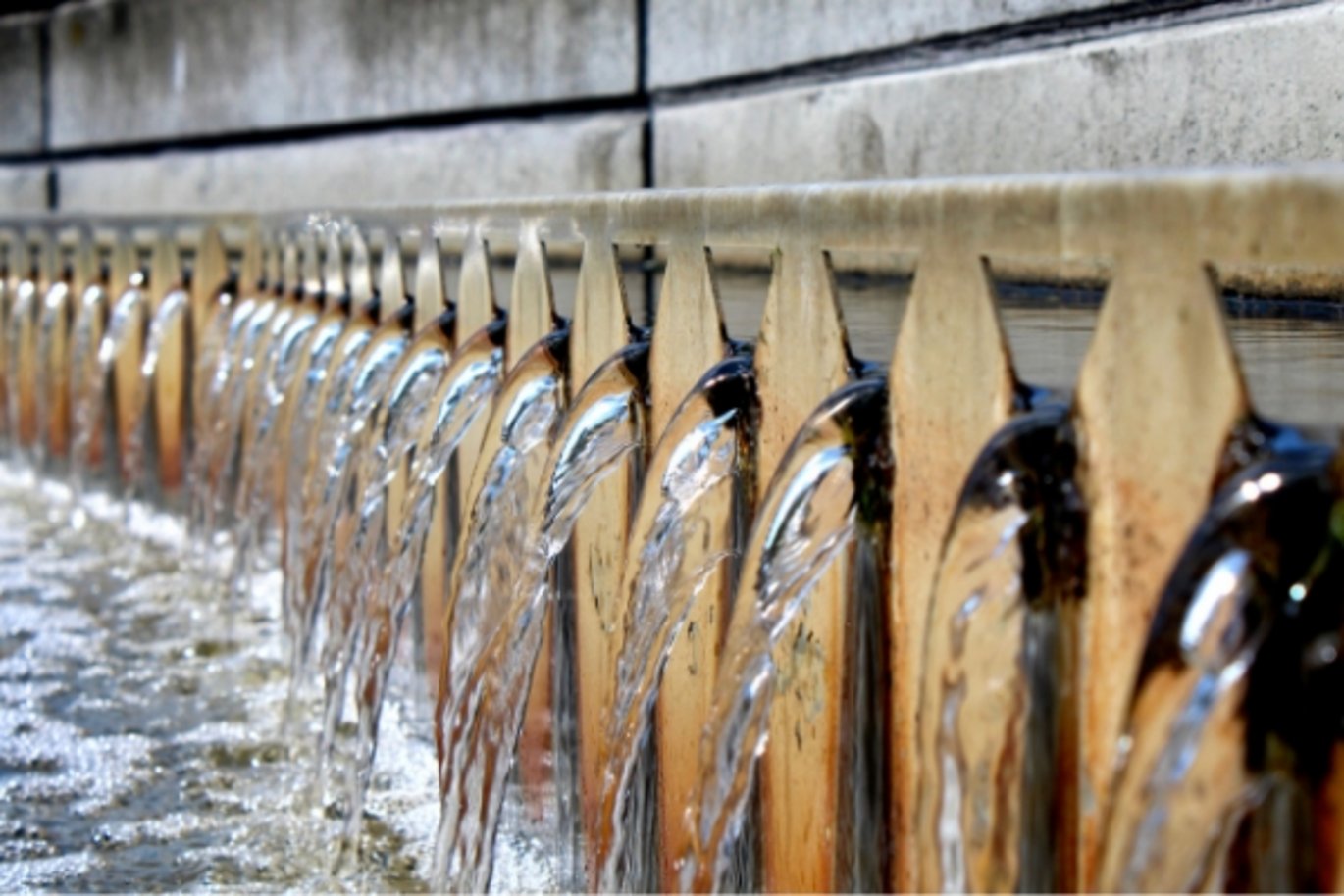 Picture shows water running through a "Secondary Clarifier" under the wastewater treatment process.